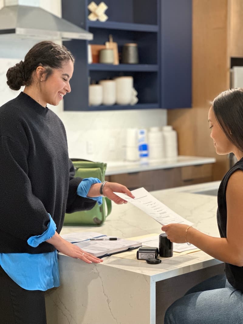 Ingrid Santos meeting a client in Austin for a mobile notary appointment